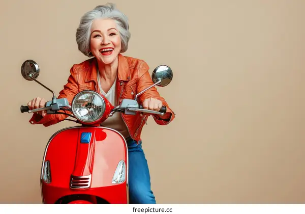 Happy Senior Woman Riding a Red Scooter