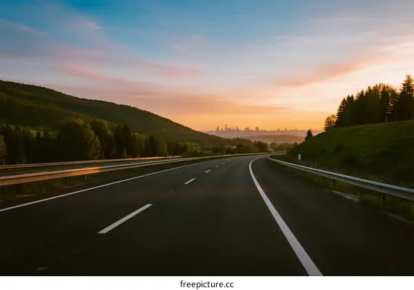 Scenic highway at sunset with mountains and clear sky