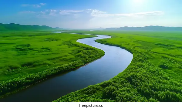 Serene River Winding Through Lush Grasslands