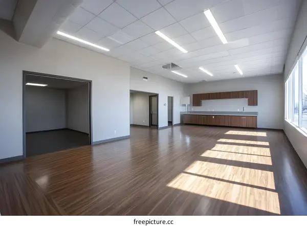 Empty Office Room With Wood Floor and Windows