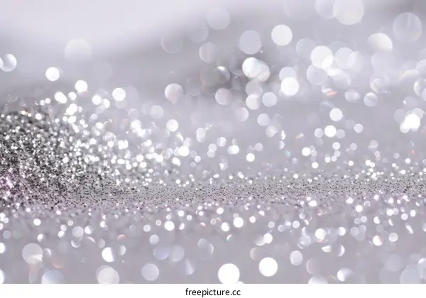 Silver glitter background with shiny sparkles