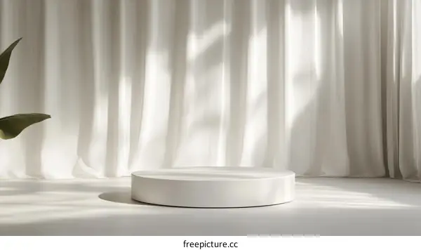 Empty White Round Display Podium with Sheer Curtains