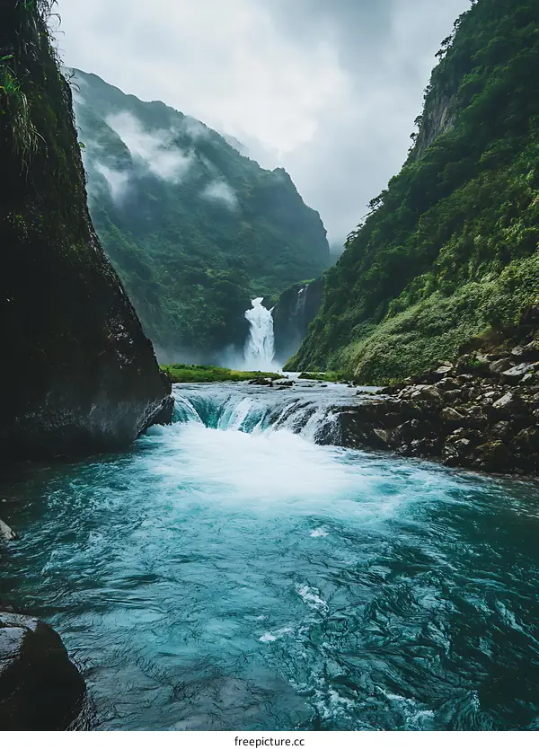 Waterfall In A Deep Green Valley