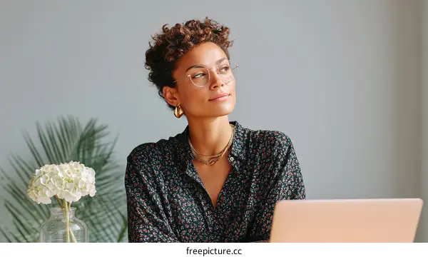 Woman working on laptop in modern setting