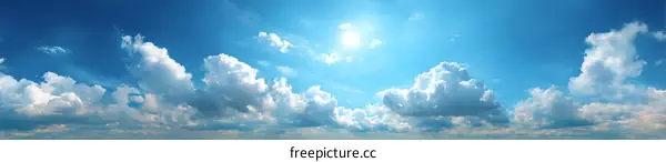 Vast Blue Sky with Fluffy Clouds