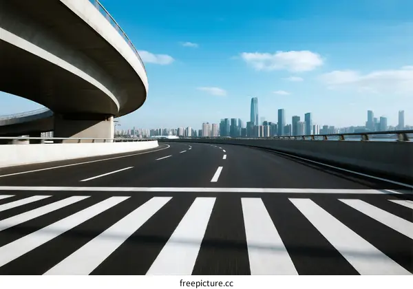 Modern city overpass with clear road and distant skyline