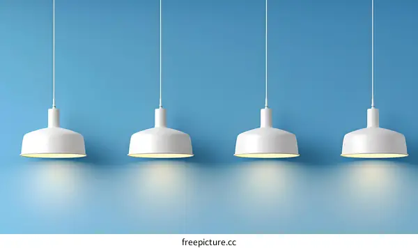 Four White Hanging Pendant Lights on Blue Background