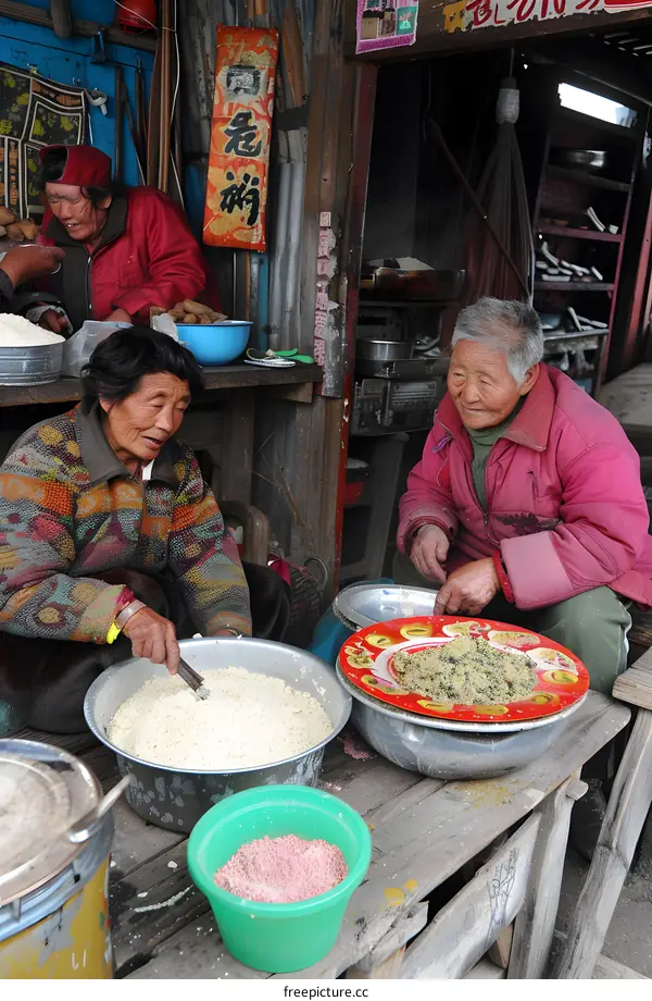 Tibetan Women Preparing Traditional Food in a Small Shop