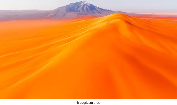 Vibrant Orange Desert Landscape with Mountain View