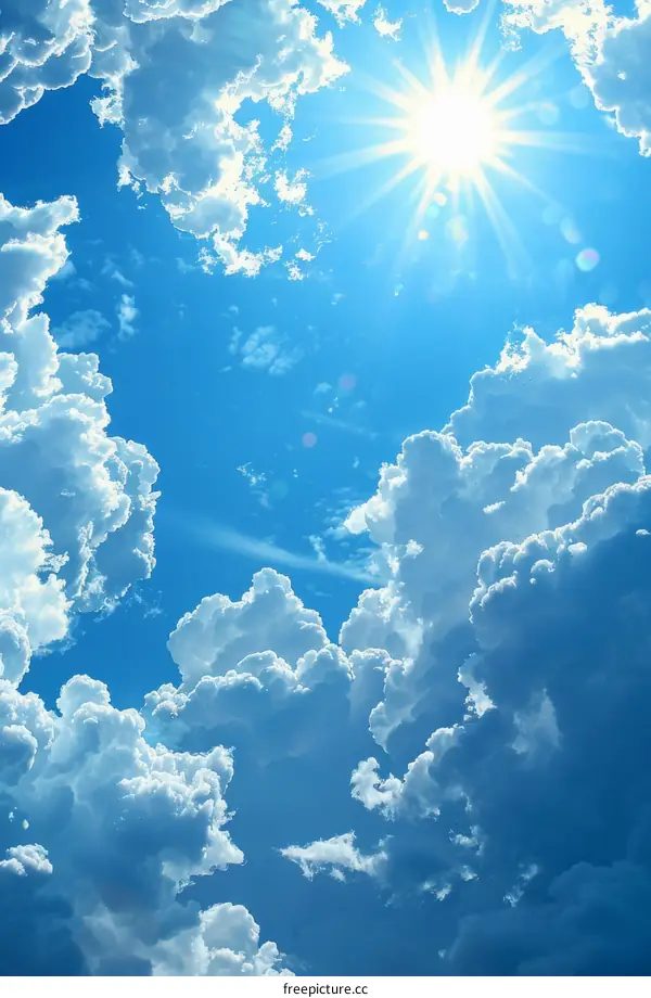 Blue sky and white clouds with sun shining through them