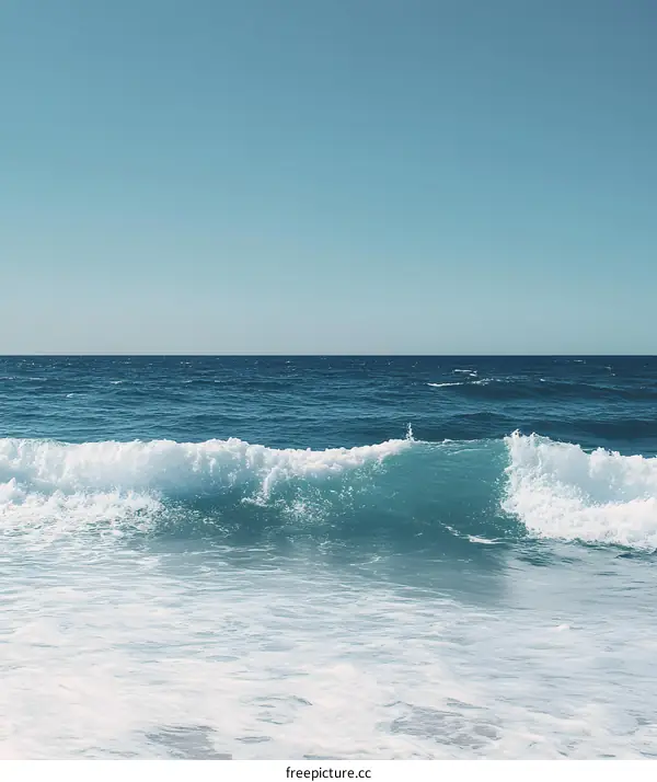 Blue Ocean Waves Breaking on the Shore