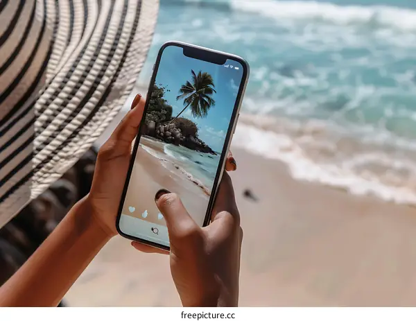 Woman on a Beach Holding a Smartphone Taking a Picture of the View