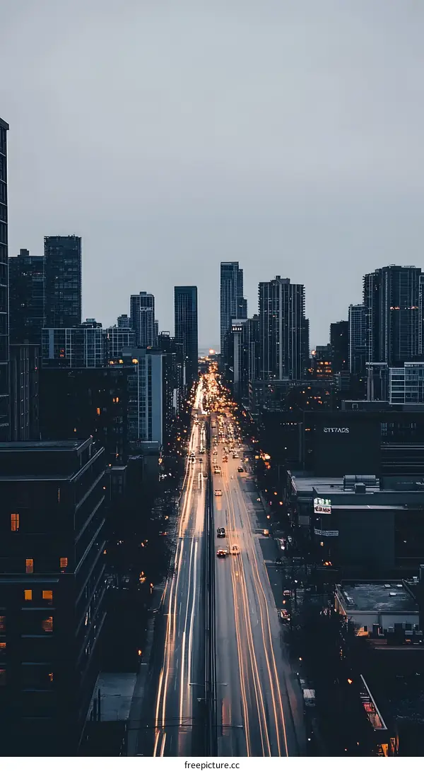 Aerial View of a City Street with Cars Driving at Night