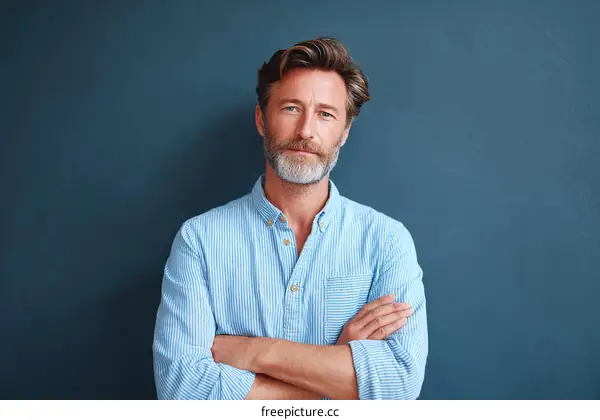 Confident Caucasian Male Portrait Against Dark Background