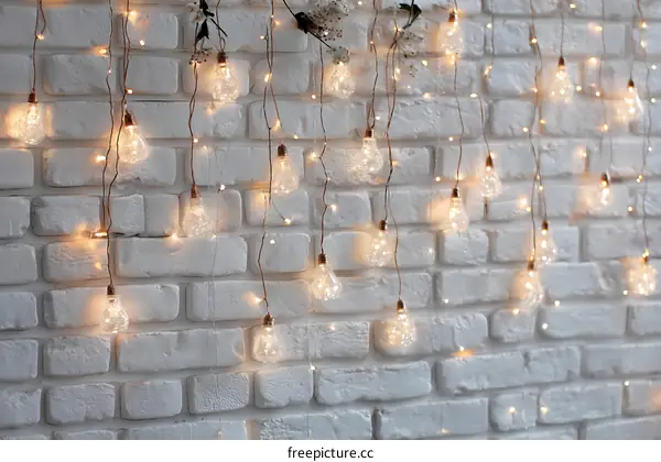 String Lights Decorated on a White Brick Wall