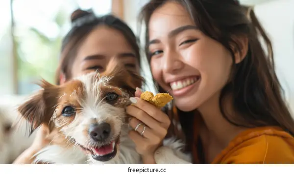 Two Asian women with a dog