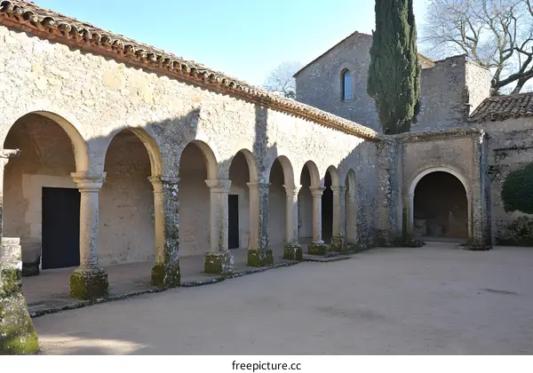Stone Arches and Columns of an Ancient Courtyard