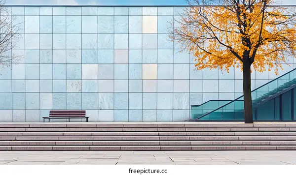 Modern Building Facade with Bench and Tree