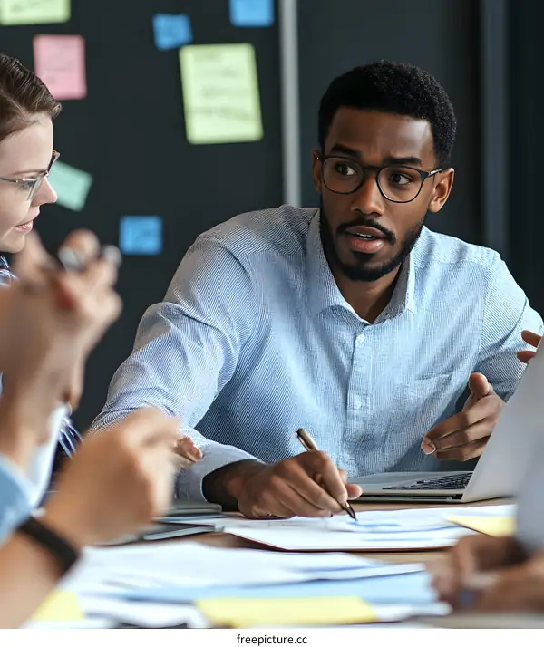 African American Businessman Leading A Meeting In Office