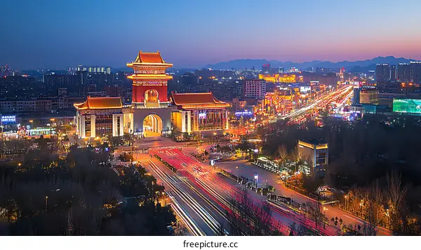 Cityscape at Dusk with Illuminated Architecture