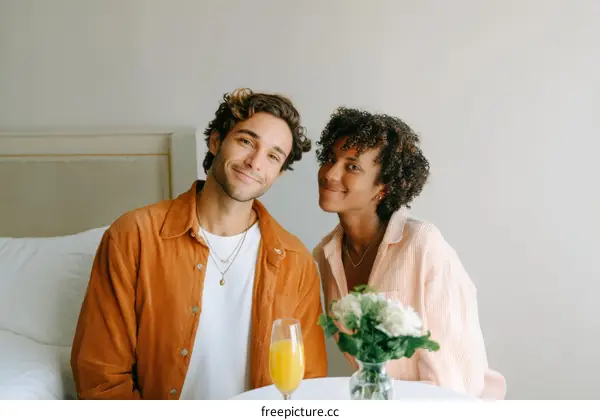 Couple Enjoying a Morning Breakfast in Bed