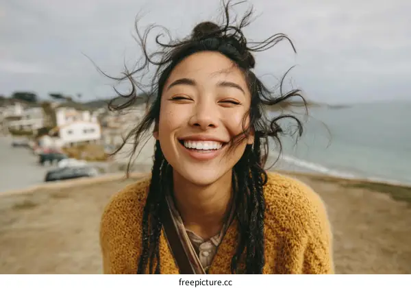 Joyful Woman Outdoors by the Ocean