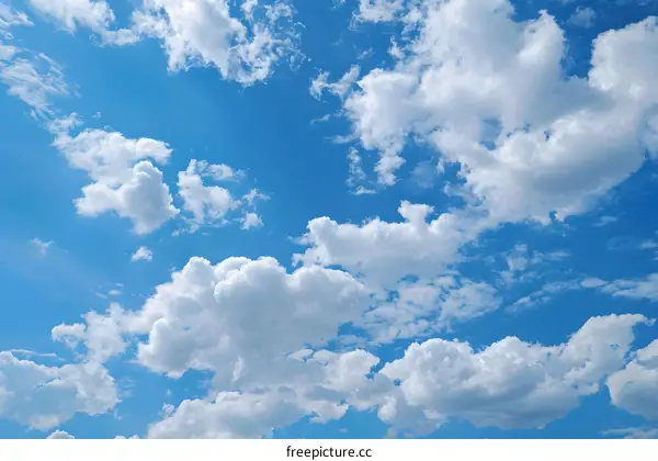 Blue Sky With Puffy White Clouds