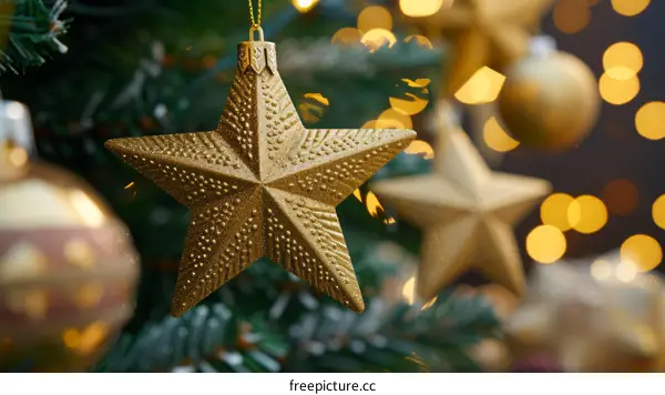Golden Christmas Star Ornament Hanging on a Decorated Tree