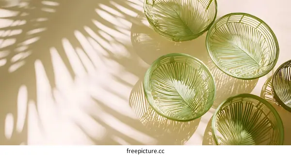 Green Woven Bowls with Palm Leaf Shadow