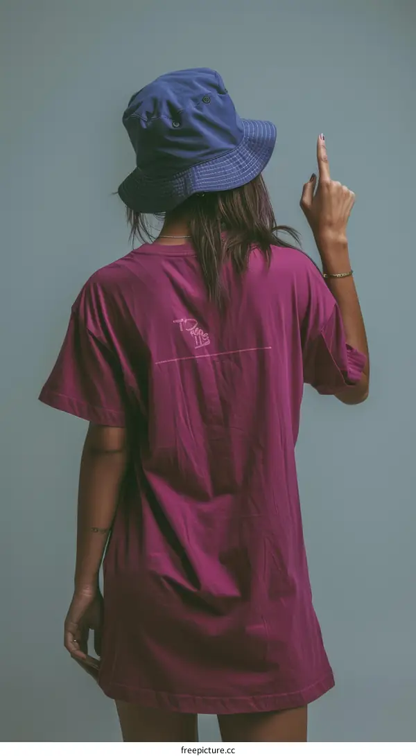 Woman in a Purple T-shirt and Blue Bucket Hat