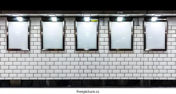 Blank Advertising Frames On Brick Wall