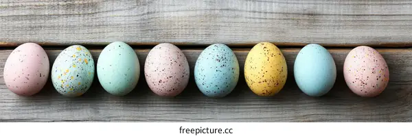 Colorful Easter Eggs on Wooden Background