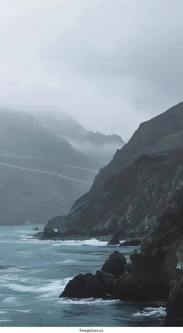 Misty Coastline with Rock Formations