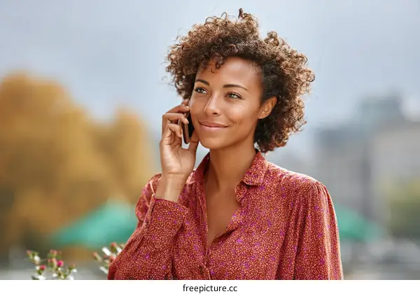 Woman Talking on Phone Outdoors in City