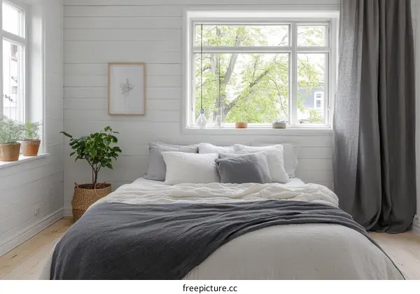 Cozy Bedroom with White Walls and Gray Bedding