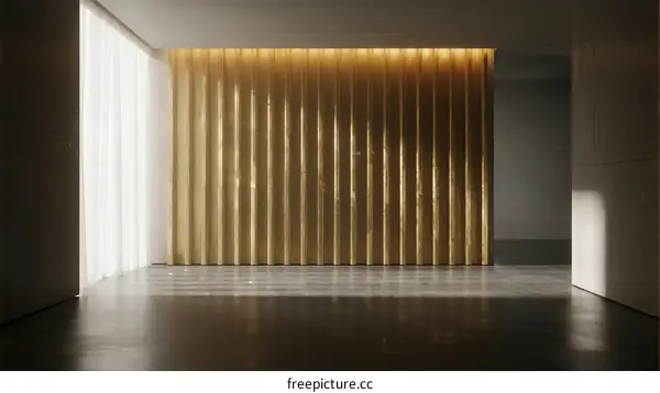 Interior space with golden vertical panel and natural light