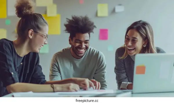 Multiethnic group of business professionals having fun brainstorming in the office