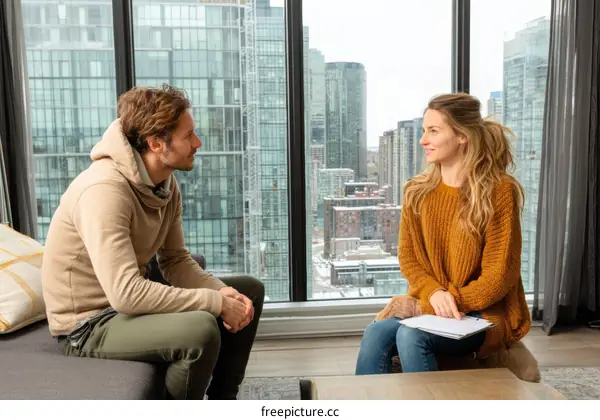Two people conversation by the window