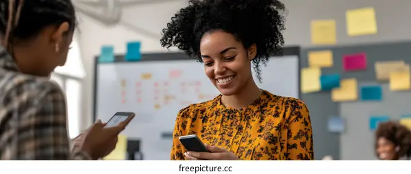 Two African American Women Working Together in an Office