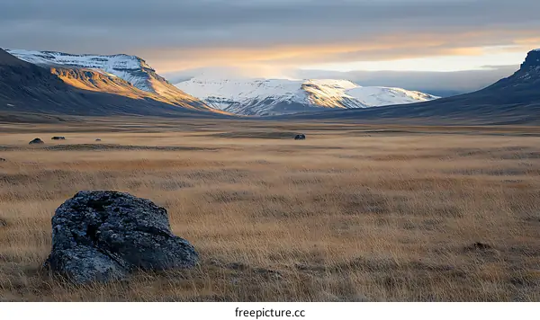 Icelandic Landscape with Mountains and Grass Field