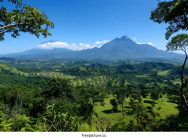 A verdant mountain landscape with a blue sky