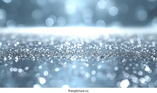 Blue glitter background with shiny sparkles