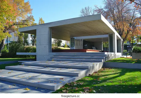 Minimalist Modern Concrete Structure with Autumn Trees