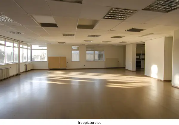 Empty Room With Windows and Wooden Floor