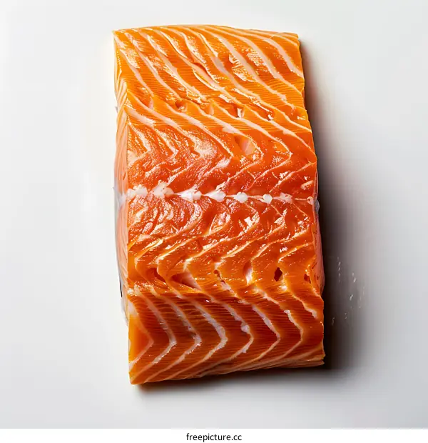 A side view of a raw salmon steak