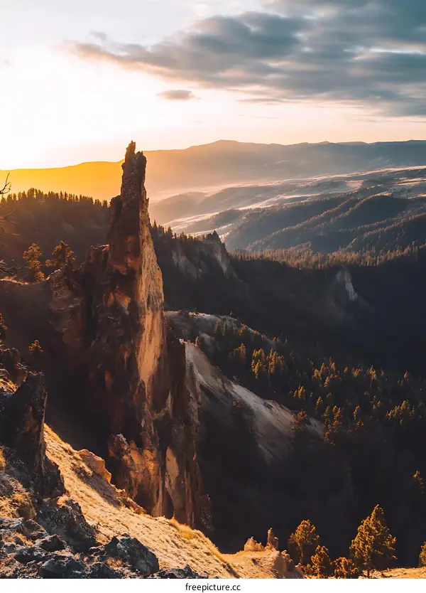 Sunrise Over Mountains With Sharp Cliff