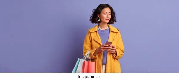 Woman with Shopping Bags and a Smartphone