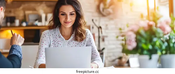 Caucasian Woman Working On Laptop In Office