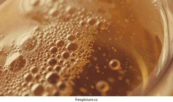 Golden Beer Bubbles Close-Up