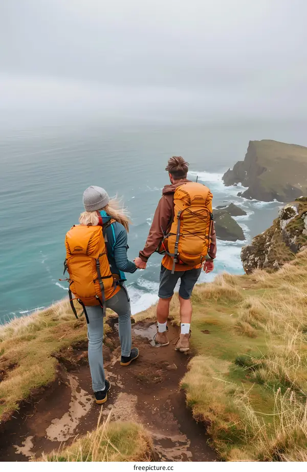 Couple Hiking on Clifftop with Ocean View